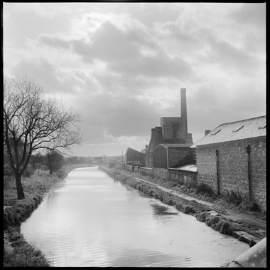 A view looking south along the Trent and Mersey Canal showing Cliffe Vale Pottery (Twyfords).