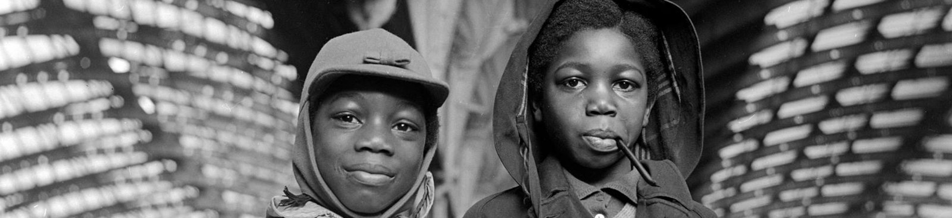 Two boys at Paddington Station. Black and white photo taken in 1960s.