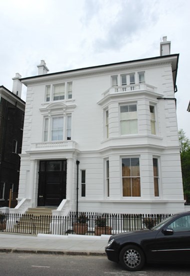 The richly stuccoed house of the 1860s at 44 Phillimore Gardens, Kensington, London, was the meeting place of the Kensington Society. 
© Historic England.