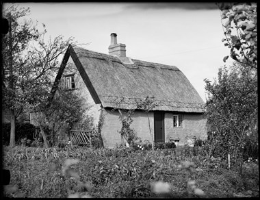 Archive photograph of vernacular buildings.