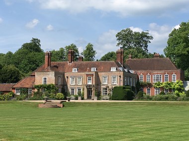 Deane House a large manor house with sweeping lawn