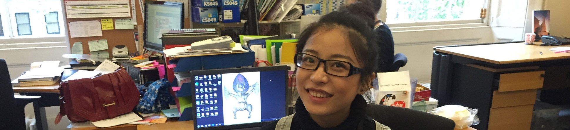 A Work Placement participant photographed in an office at the British Museum.