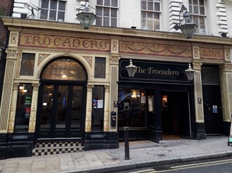 Exterior view from the street of the decorative gold and back front to Albert Chambers Trocadero in Birmingham, UK.